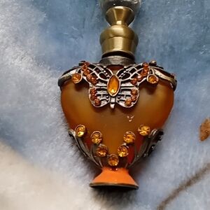 Orange Heart-Shaped Perfume Bottle with Butterfly Design